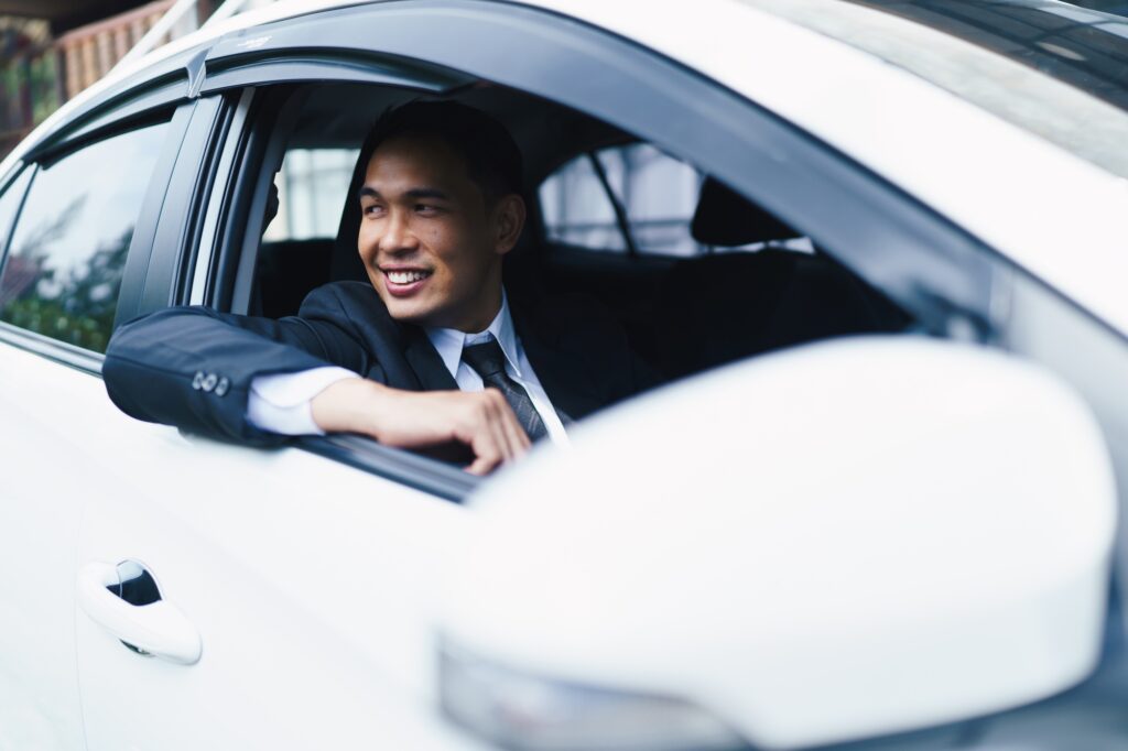 Car dealer man. Auto dealership and rental concept.